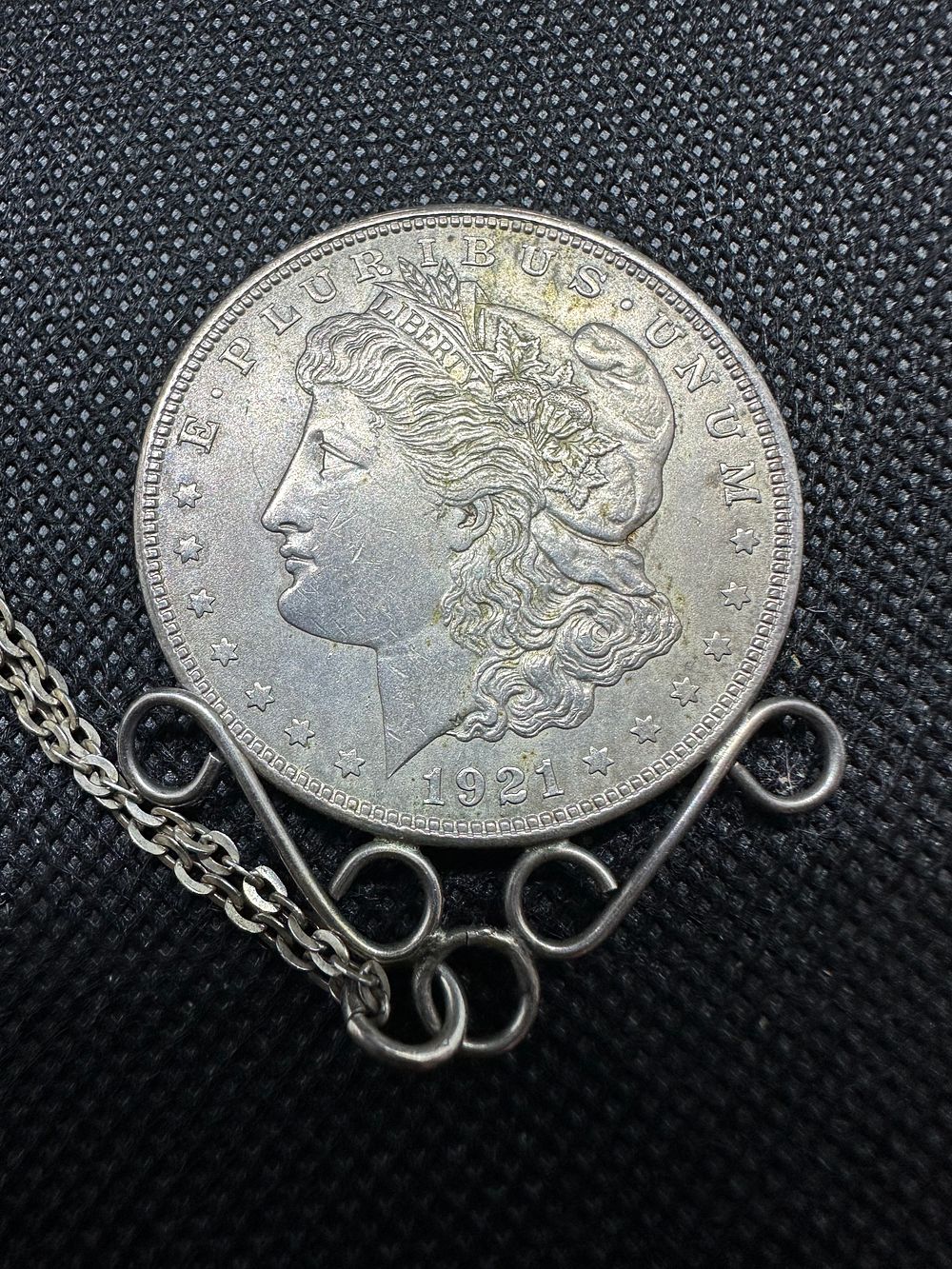 Lot 183: 1912 United States Silver one Dollar coin - turned necklace.