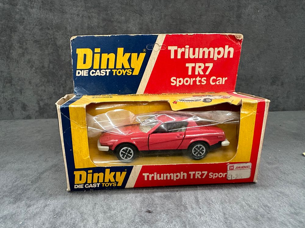 Lot 204: Dinky Diecast Toys #211 Triumph TR7 Sport in Red. Diecast in great condition box has slight crushing as pictured.
