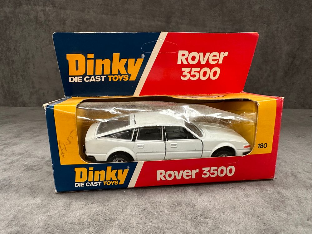 Lot 202: Dinky Diecast Toys #180 Rover 3500 in white. Diecast in great condition box has slight crushing as pictured.