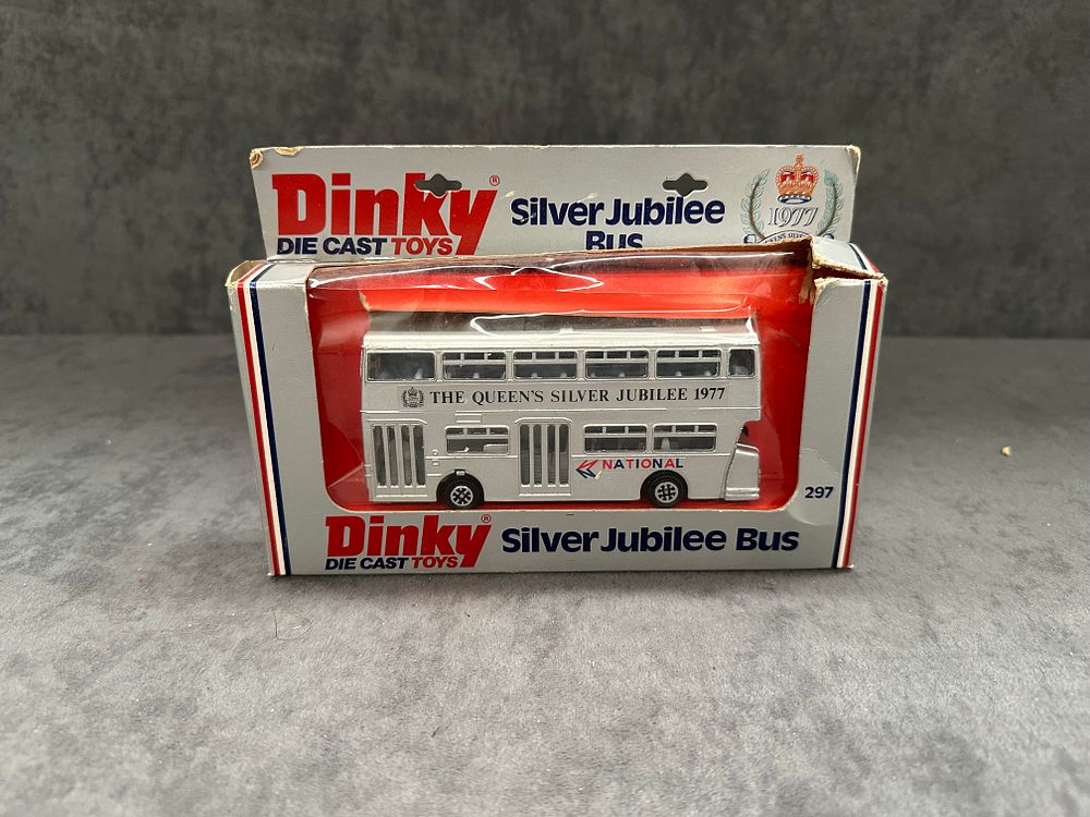 Lot 201: Dinky Diecast Toys #297 Queens Silver jubilee Bus. Diecast in great condition box has slight crushing as pictured.