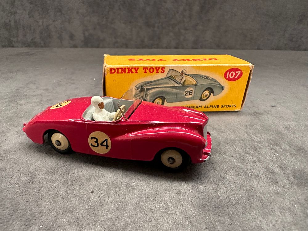 Lot 180: Dinky Toys 107 Sunbeam Alpine Sports. good box and model.