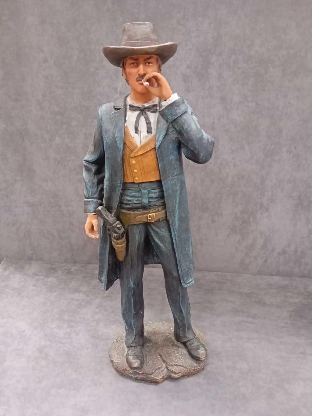 Lot 69: Large figurine of a Western man smoking with...