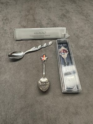 Set of three commemorative spoons one for Canada one for Harry and Megan miracles’s wedding and 