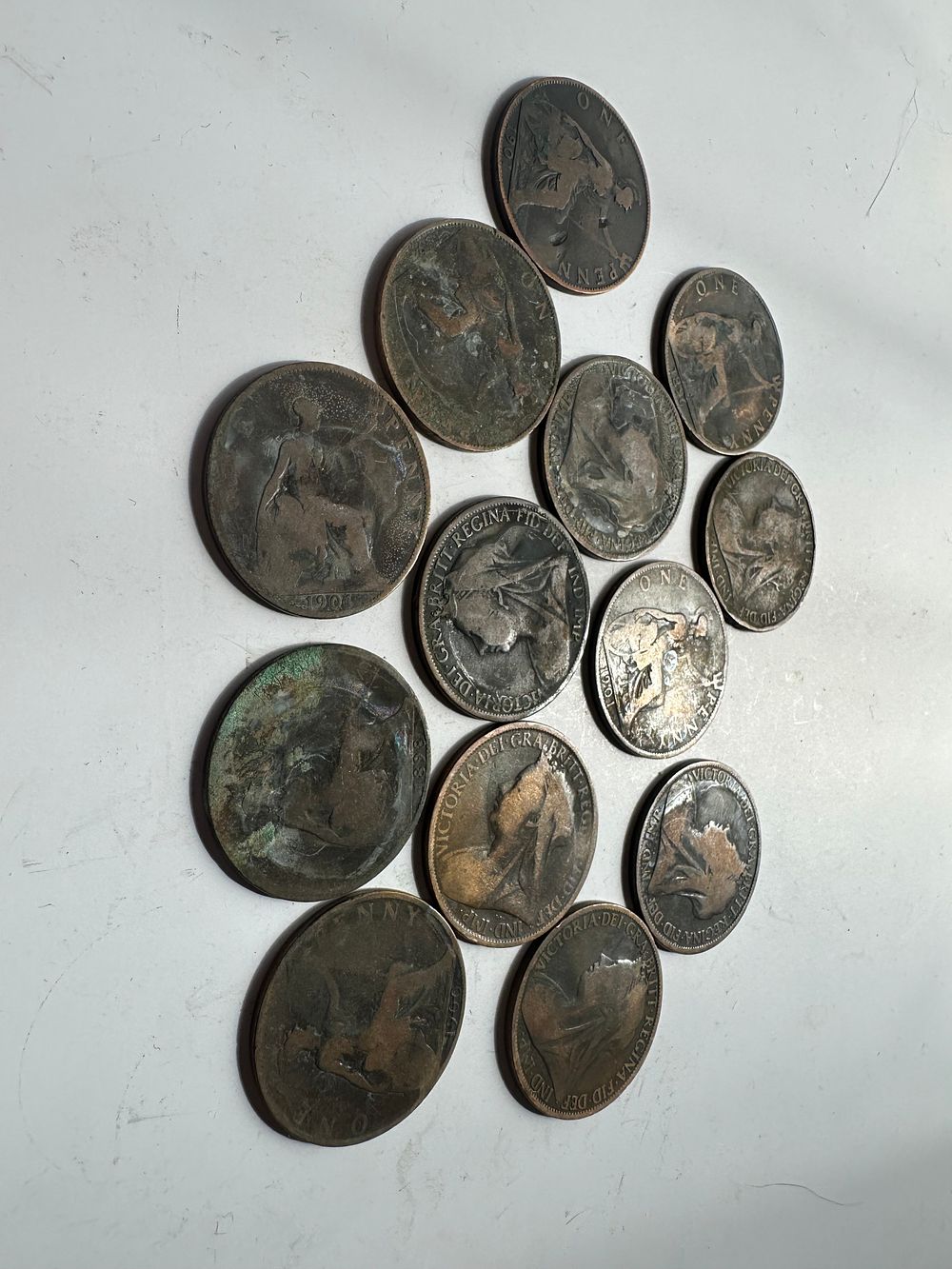 Lot 229: 13 worn Queen Vic pennies 