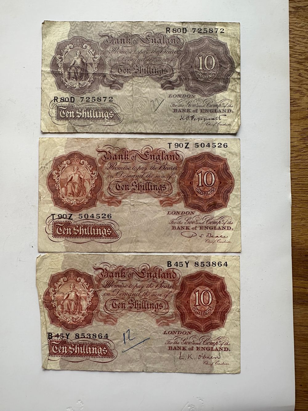 Lot 418: 3×10 shilling notes as pictured