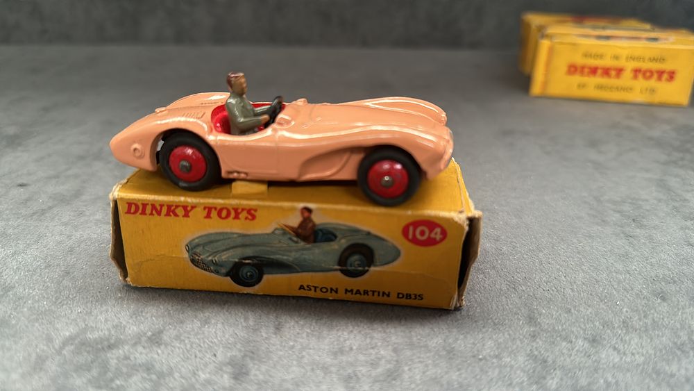 Lot 322: VERY RARE VINTAGE DINKY # 104 MINT ASTON MARTIN DB3S DIECAST CAR PINK/RED 1958 in box (some slight damage to box as pictured.