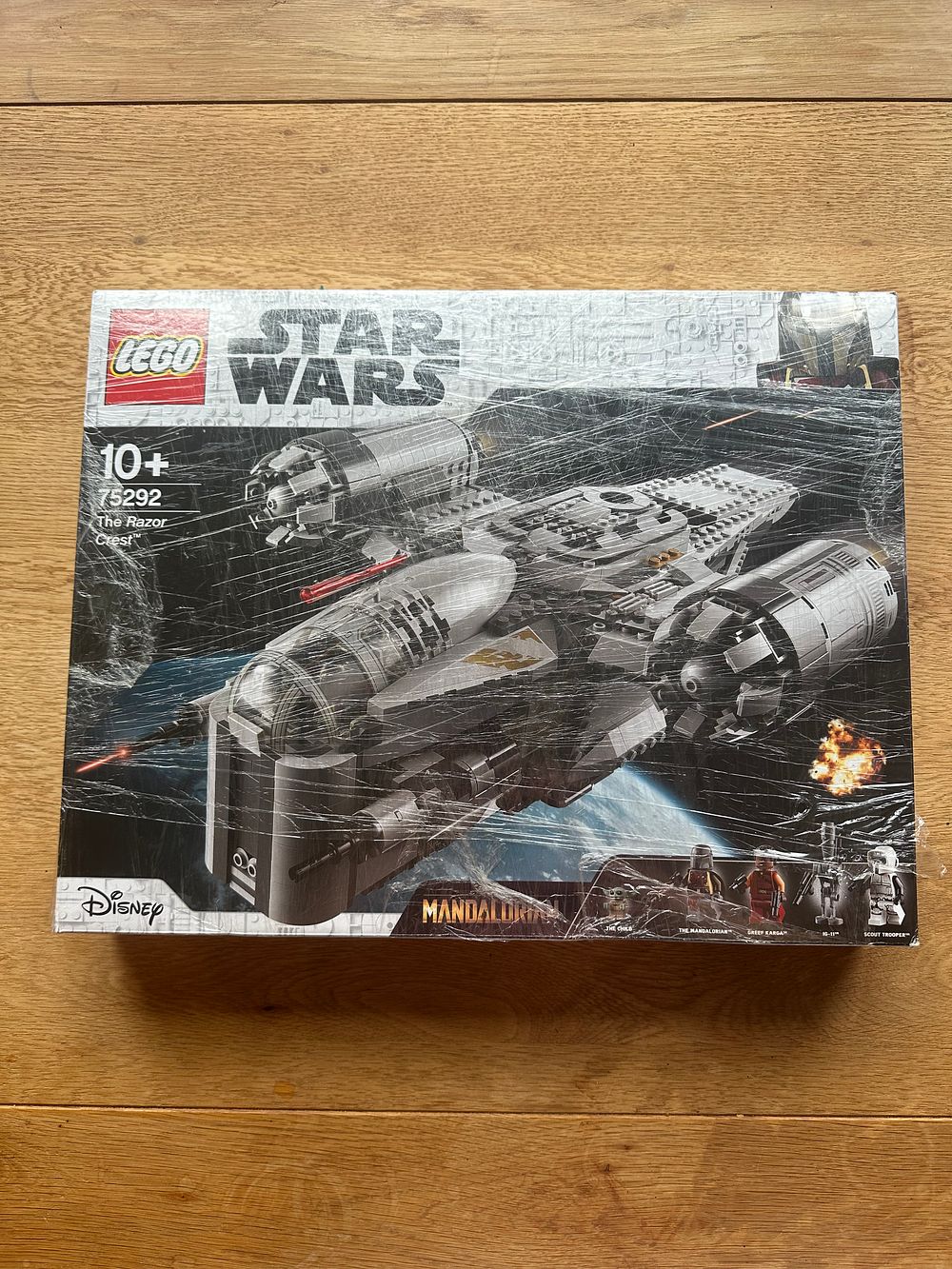 Lot 199: Lego Star Wars 75292 the razor crest set is unopened with polythene still on the outside