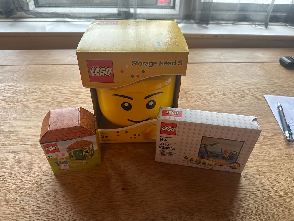Lot 196: Max lot of Lego all new and unopened one Storage head one pirate set and one Easter bunny and House