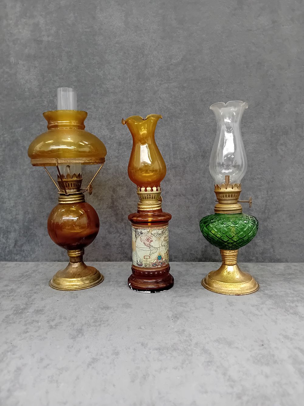 Lot 767: 3 paraffin lamps various designs and sizes as...
