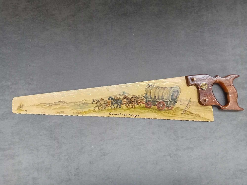 Lot 772: Hand painted saw with painting of a conestoga...