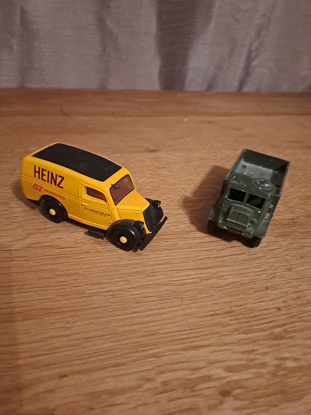Lot 434: 2 dinky vehicles 1army wagon c23 played with condition and 1 heinz black and yellow van 1950s ford
