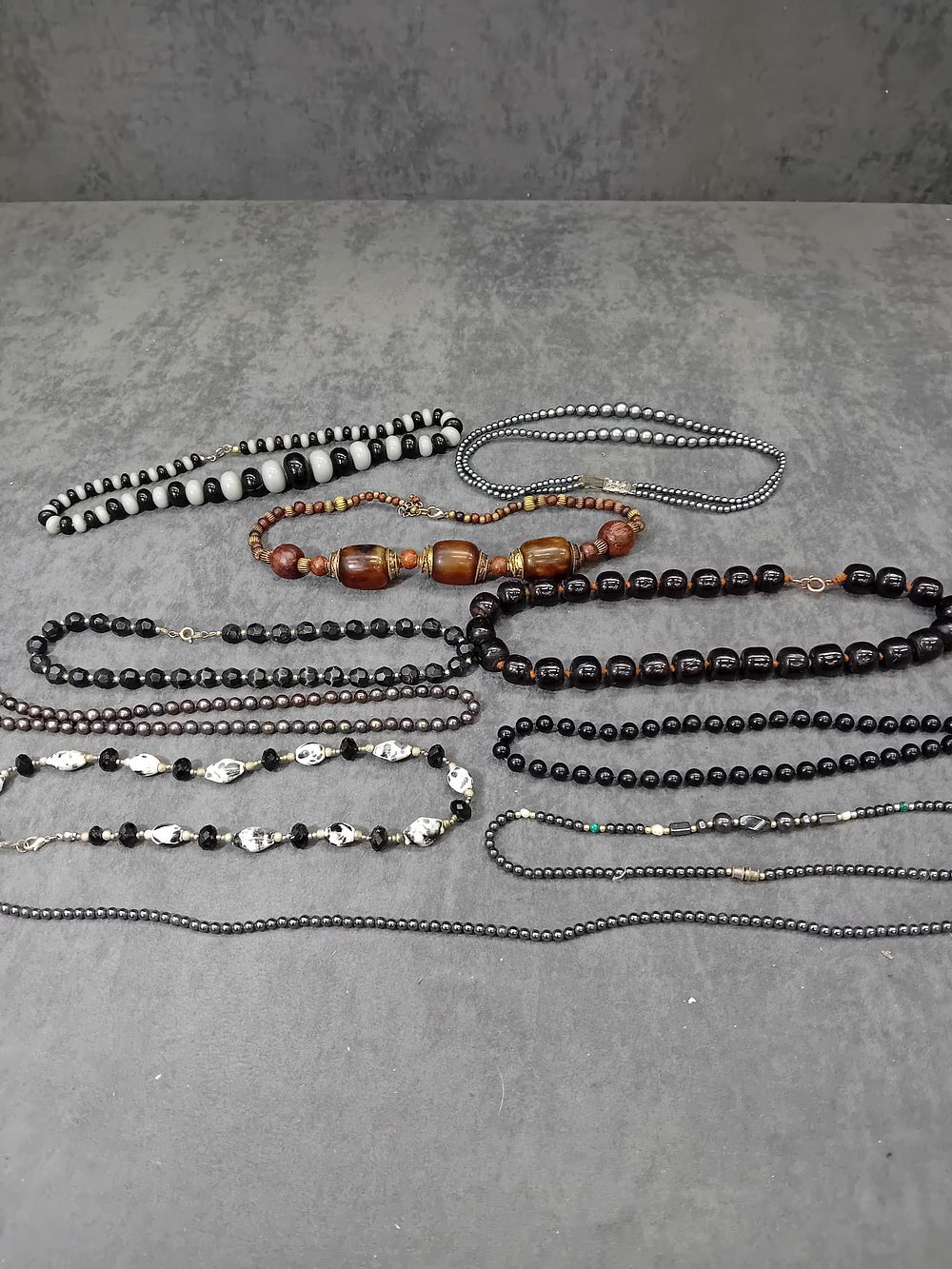 Lot 568: Mixed Lot of beaded Jewelry. Dark and metallic...