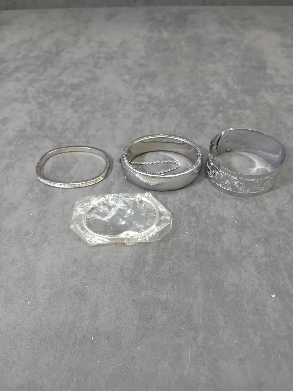 Lot 558: Mixed lot of Silver Coloured Bangles as pictured....