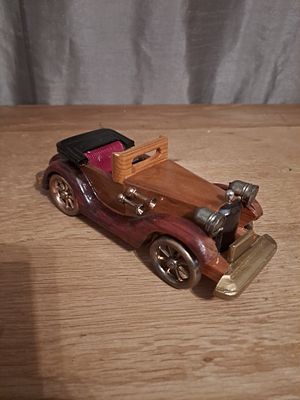 Hand made wooden car with gold plastic trims and wheels