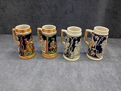 Set of 4 Vintage German Beer Steins - Hand-Painted Stoneware 
This stunning set of four vintage 