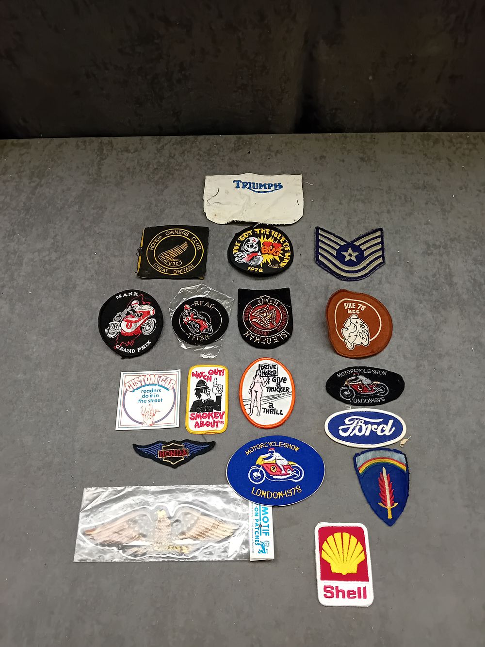 Lot 330: Lot of 18 Sew on badges bike and...