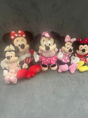 A collection of mini mouse teddy’s 1 is a standing electronic toy