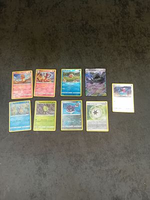 Mixed lot of Holo and one EX Houndstone Pokemon cards as pictured.