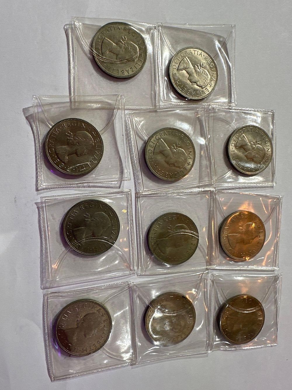 Lot 283: 10 x 1963 UNC Half Crown in plastic...