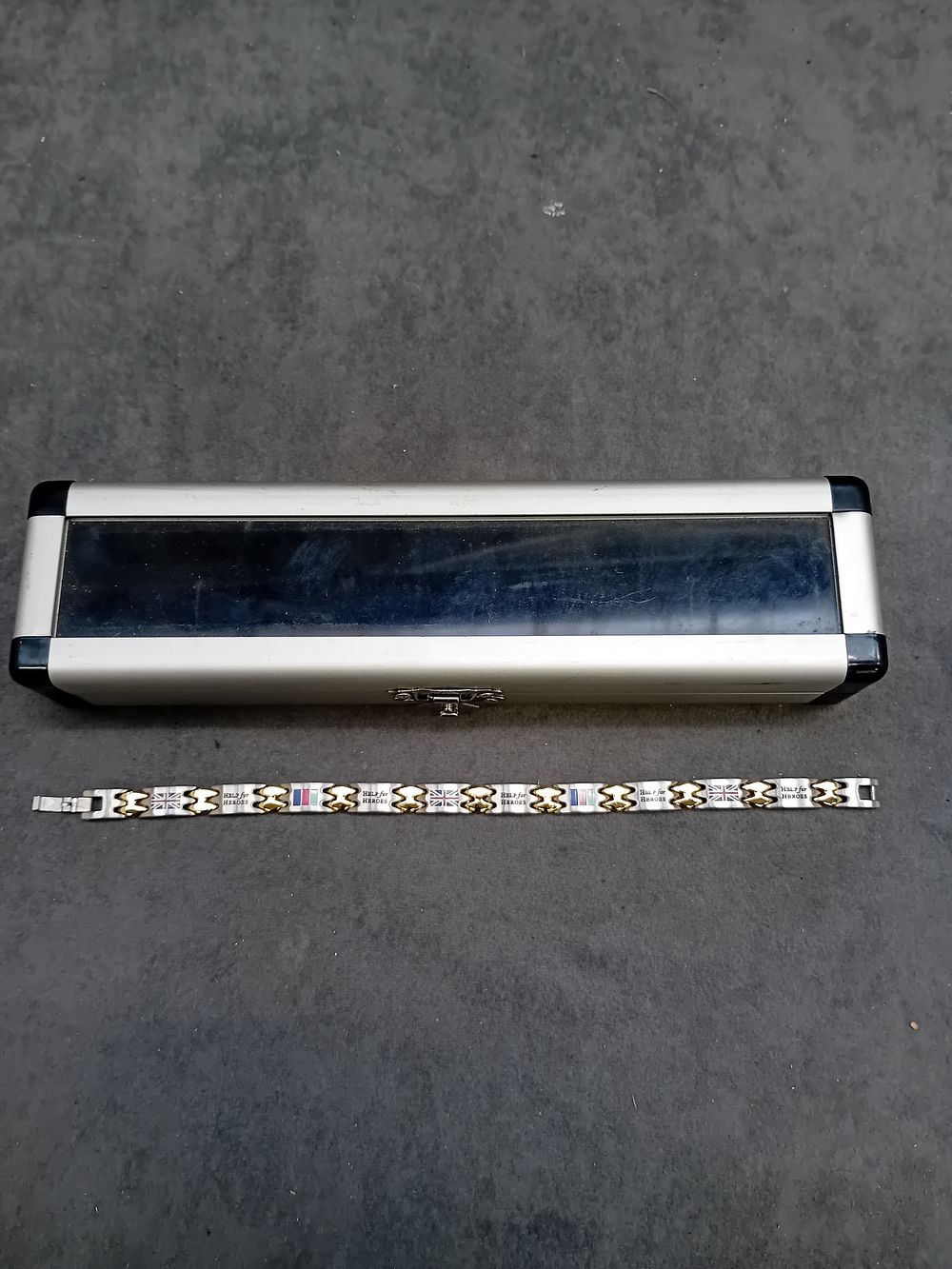 Lot 302: Help For Heros Stainless steel Bracelet in case...
