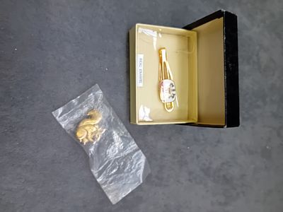 Mixed lot containing 1 Squirrel pin badge and 1 Enamel Tie clip