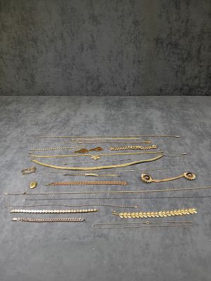 Mixed Lot Of Gold Coloured Jewelry Mainly Necklaces and Bracelets as pictured.