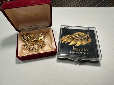 Two pretty items includes a n brooch and scarf clip.