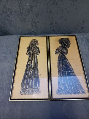 Lot of 2 Antique Brass Rubbings in a black and gold Frame 
size 25cm x 53cm