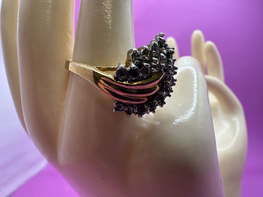 Lot 321: 14k Plated gold Ring with leaf stone design....