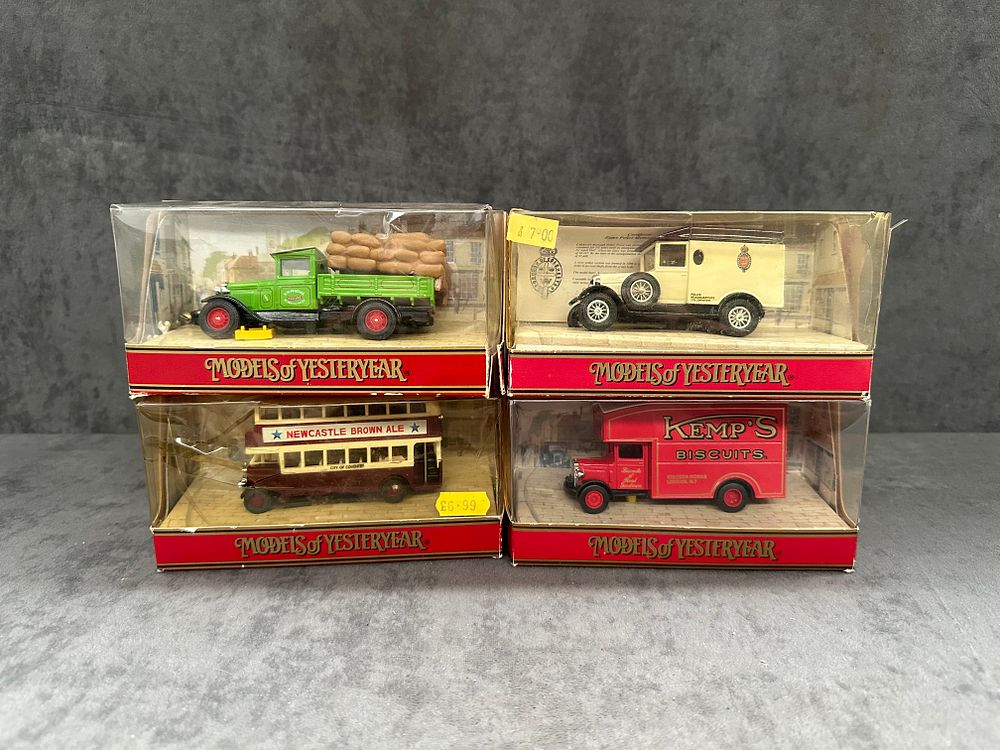 Lot 414: 4 x Matchbox Models of the yesteryear Y-31 1931 Morris Courier (Kemps Biscuits in Red) Y-19 1929 Morris Cowley Van (Colchester Police Ambulance) Y5-c 1930 Leyland Titan TD1 (Newcastle Brown Ale) Y62 1932 Model AA Ford 1.5 Ton Truck (GW Peacock Haulage in