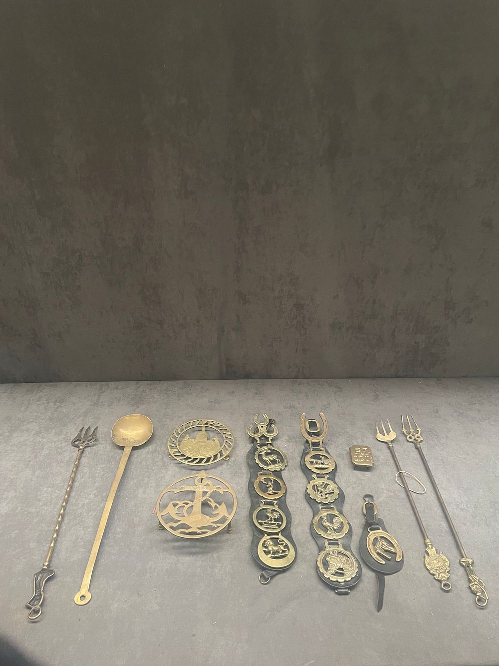 Lot 397: A selection of brassware containing fireplace equipment, heat...