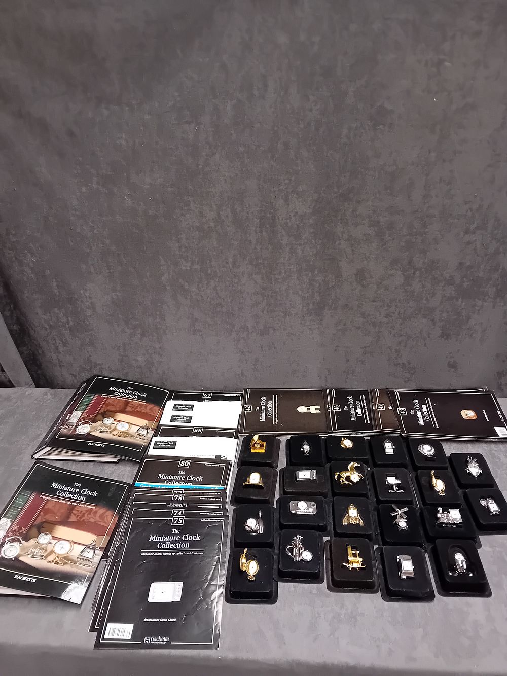Lot 387: THE MINITURE CLOCK COLLECTION BY HACHETTE 