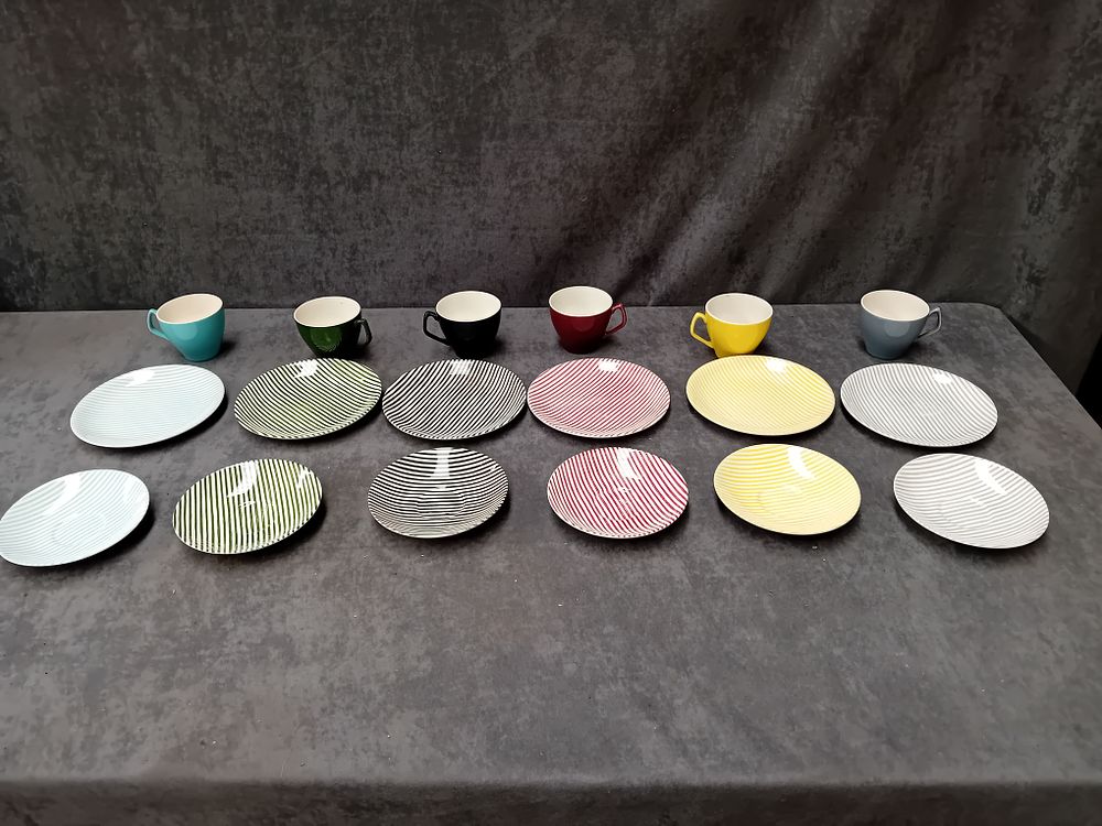 Lot 356: Colorful tea set containing  6 Cups 6 Saucers...