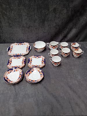 Large Tea set by Bell China Containing 
6 x Tea Cups 
1 x Milk Jug 
5 x Saucers 
6 x Square 