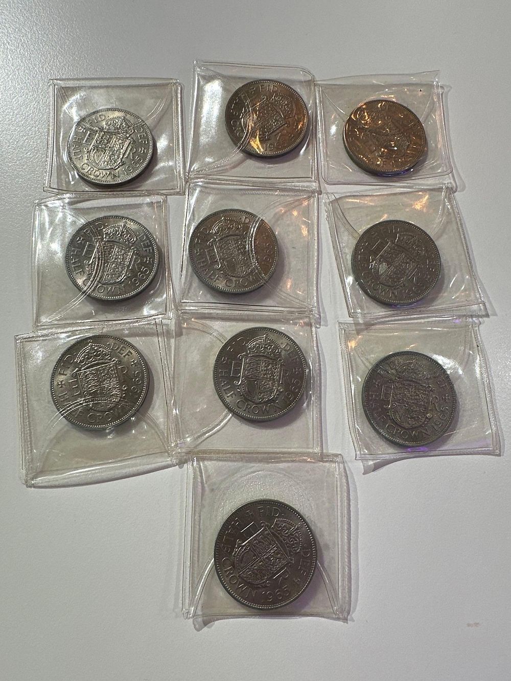 Lot 406: 10 x 1965 UNC Half Crown in plastic...