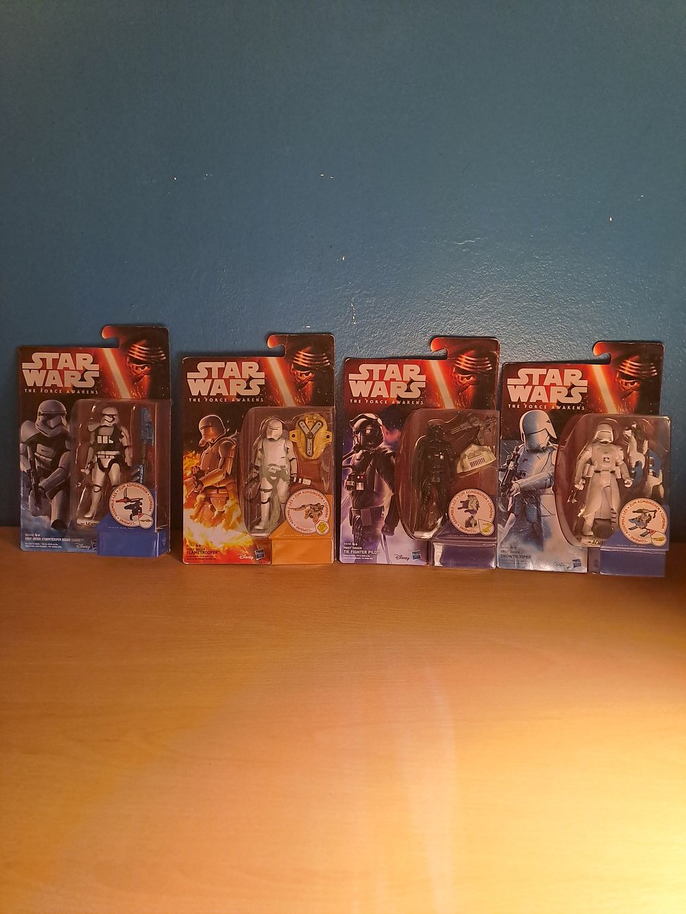 Lot 189: Starwars the force awakens containing 4 figures first order Stormtrooper squad leader, first order flame trooper, first order tie fighter pilot and first order snow trooper