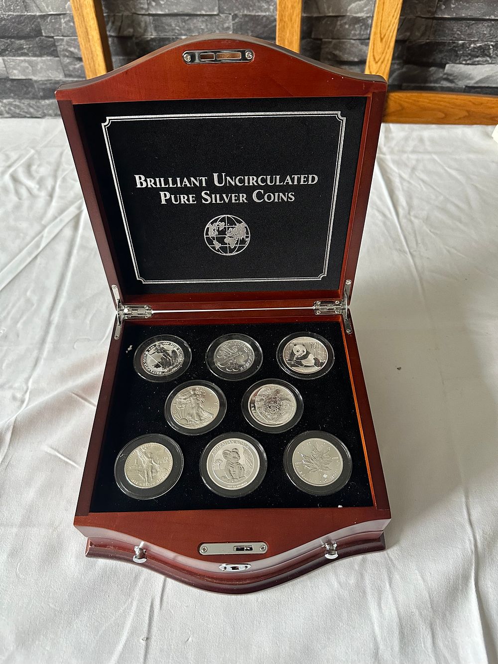 Lot 392: A PURE SILVER Collection of Eight Brilliant Uncirculated silver World coins ( Fine Silver)