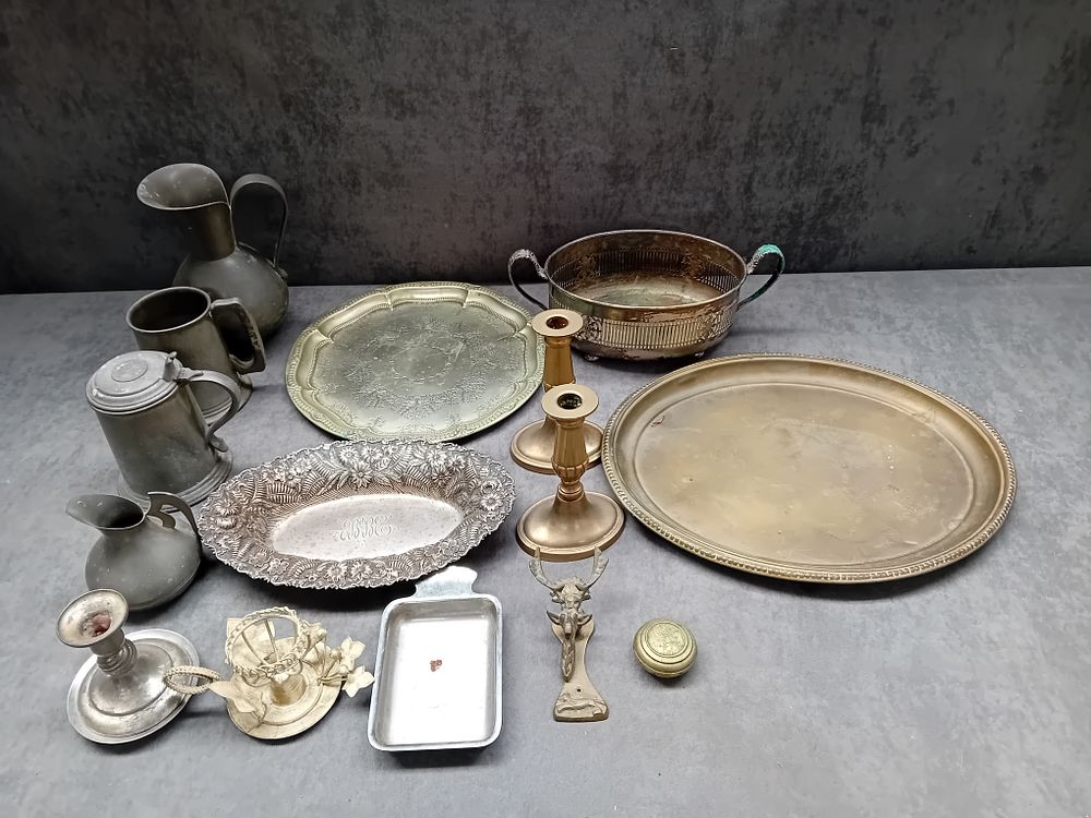 Lot 562: Large mixed lot of metalware containing steins, Jugs...