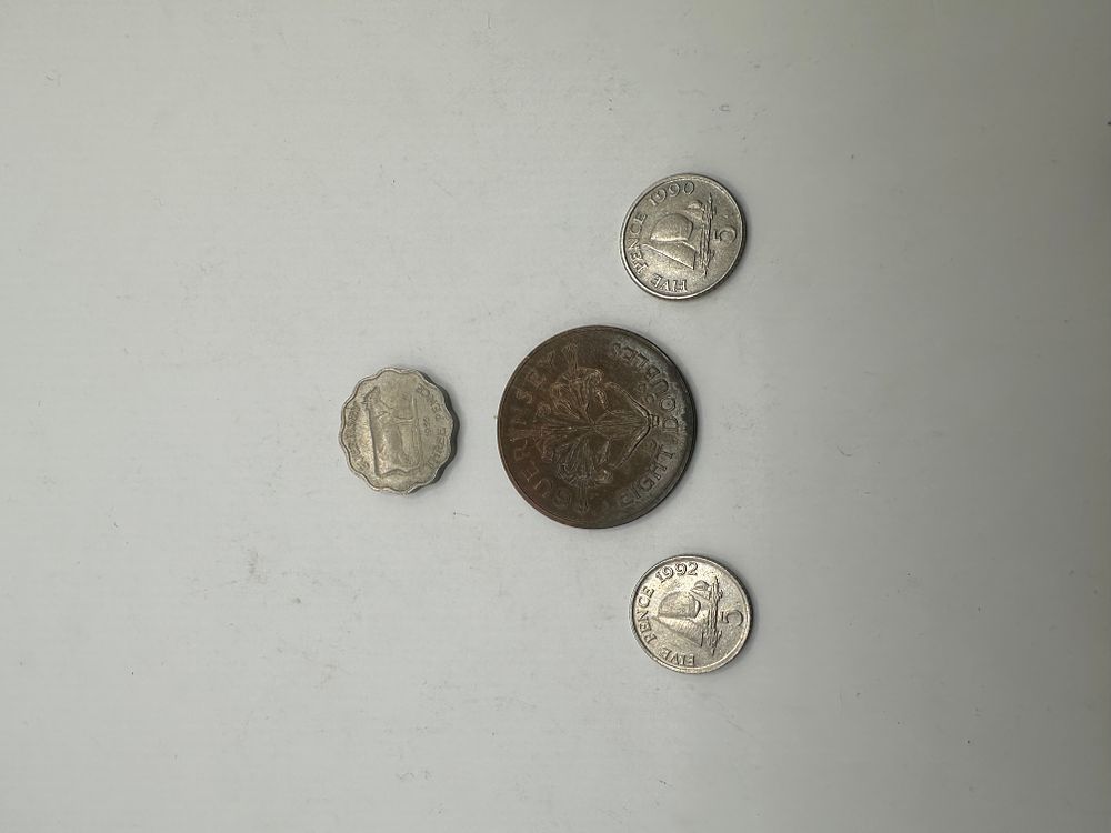 Lot 343: A Group of Four Guernsey Coins, Mid-to-Late 20th Century