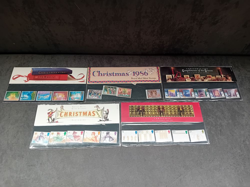 Lot 340: Lot of 5 Christmas themed stamp Presentation packs...