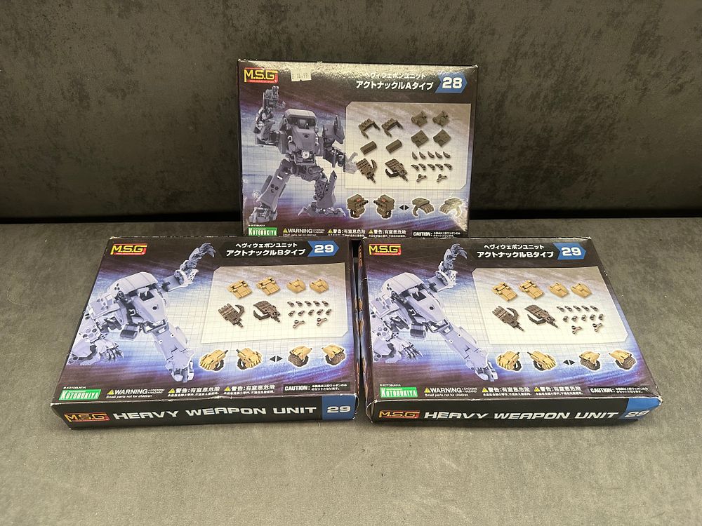 Lot 263: Three Kotobukiya M.S.G Heavy Weapon Unit Model Kits, comprising Act Knuckle A Type and two Act Knuckle B Type