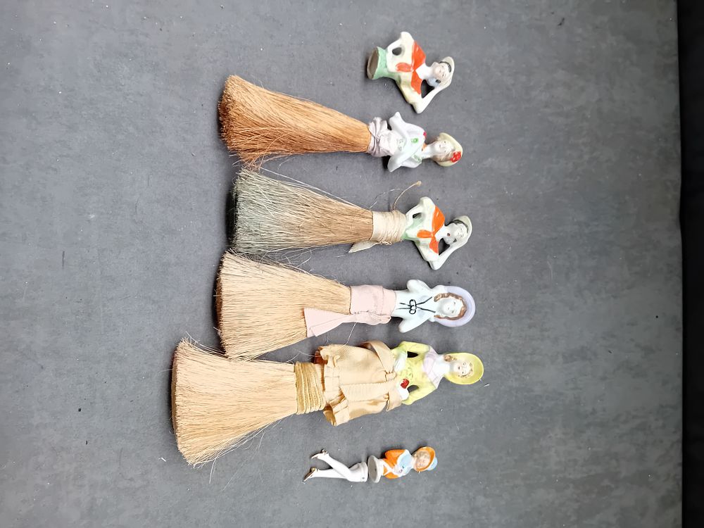 Lot 532: A Group of Six German Porcelain Half Doll Brushes and Figures