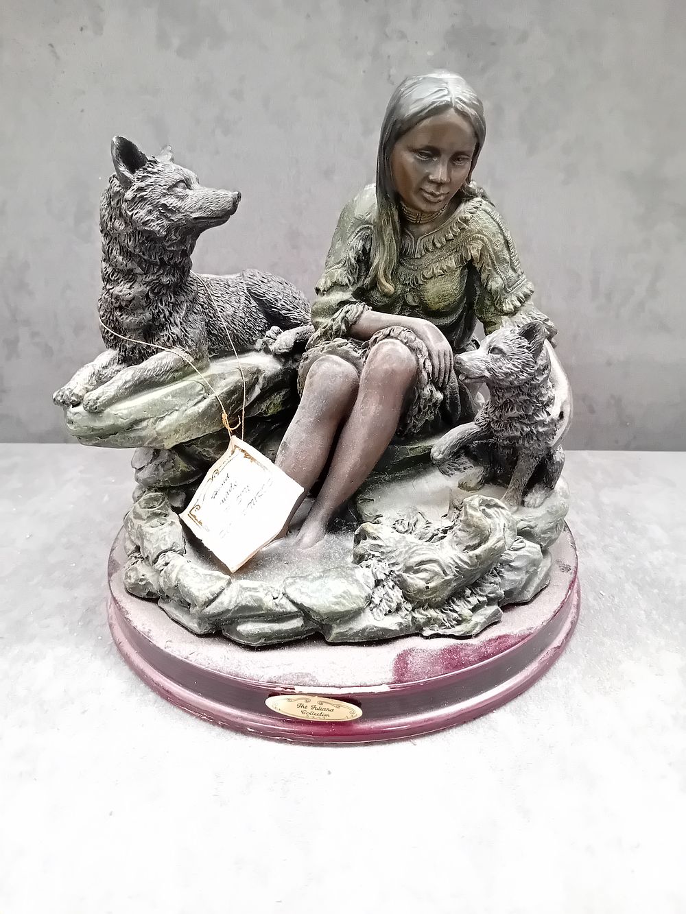Lot 389: The Juliana Collection Native American Woman with Wolves Figurine