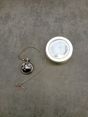Quartz Biker Pocket watch as pictured in metal watch tin