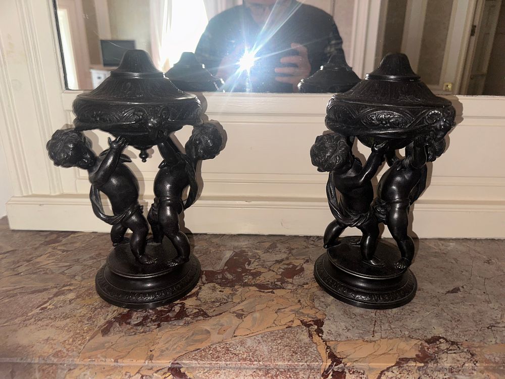 Lot 1004: A Pair of Late 19th/Early 20th Century Neoclassical Revival Bronze Putti Lidded Urns