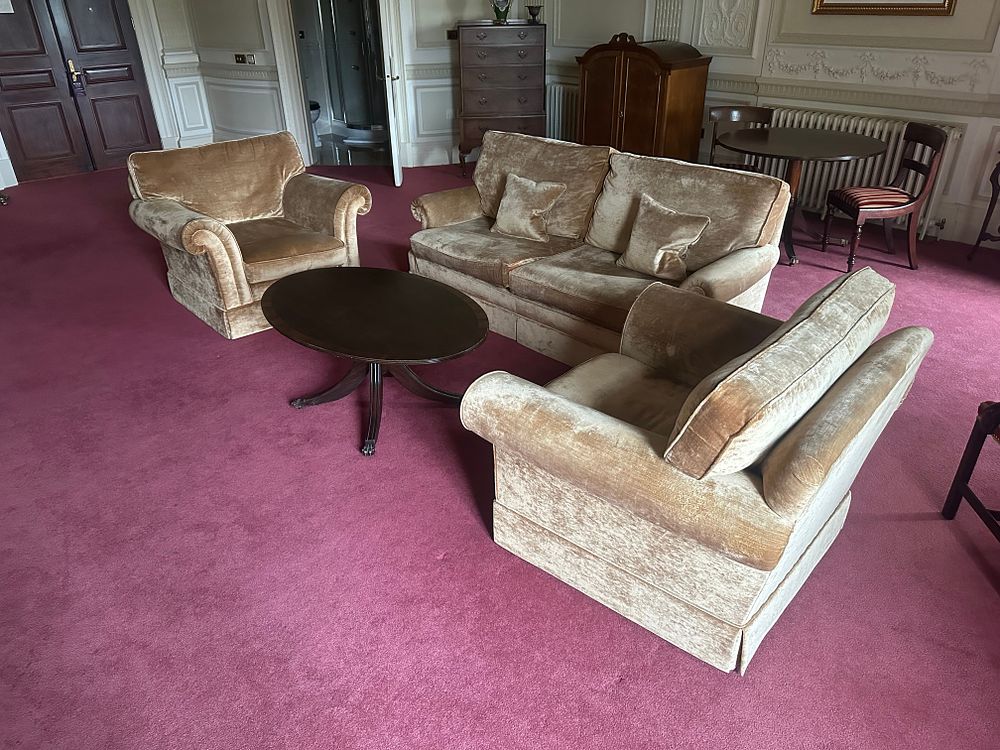 Lot 1019: A Three-Piece Upholstered Sofa and Armchair Set, a Coffee Table, and a Queen Anne/Georgian Revival Style Chest of Drawers