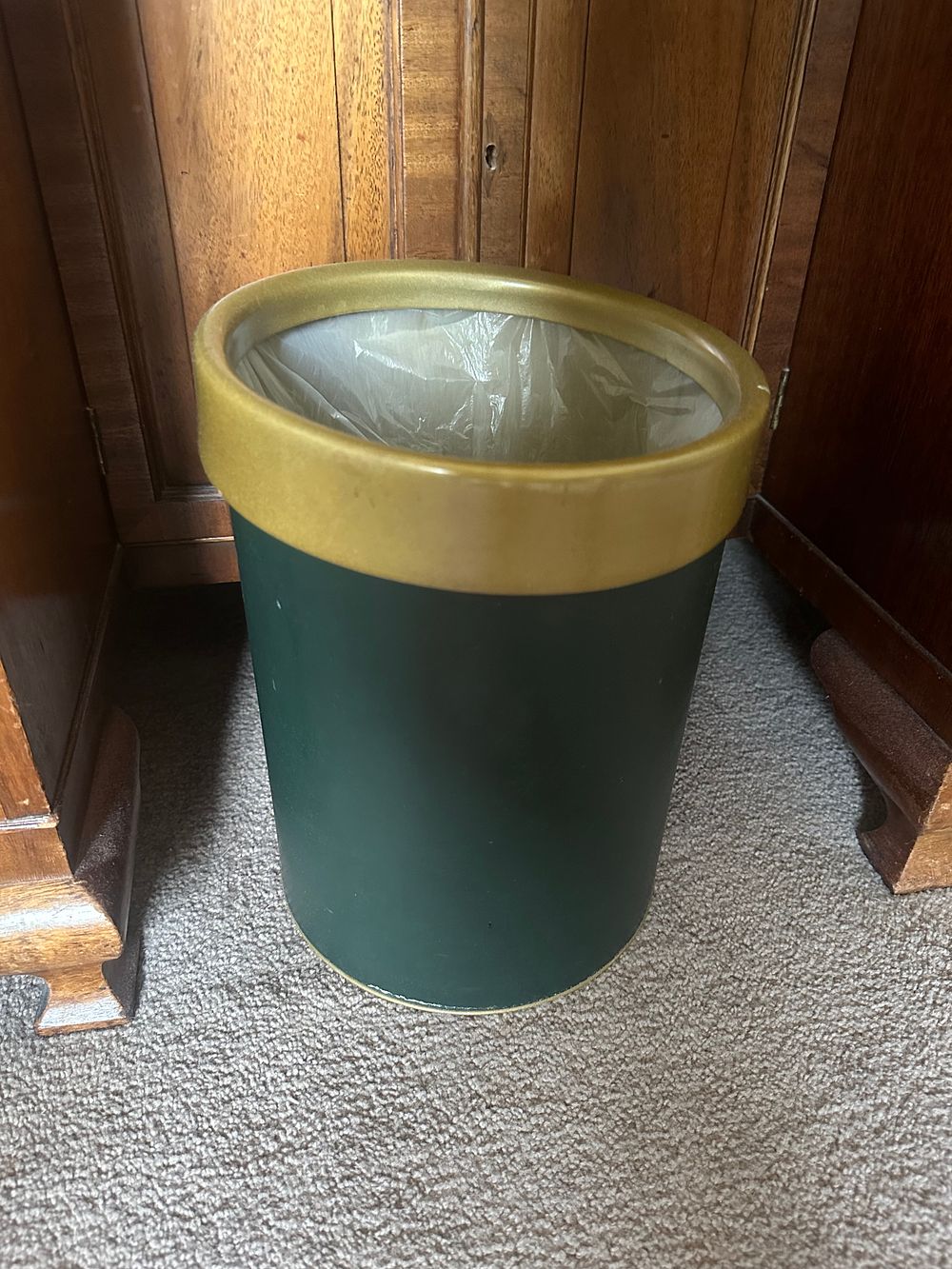 Lot 1058: A Modern Cylindrical Dark Green Waste Bin with Gold-Toned Rim