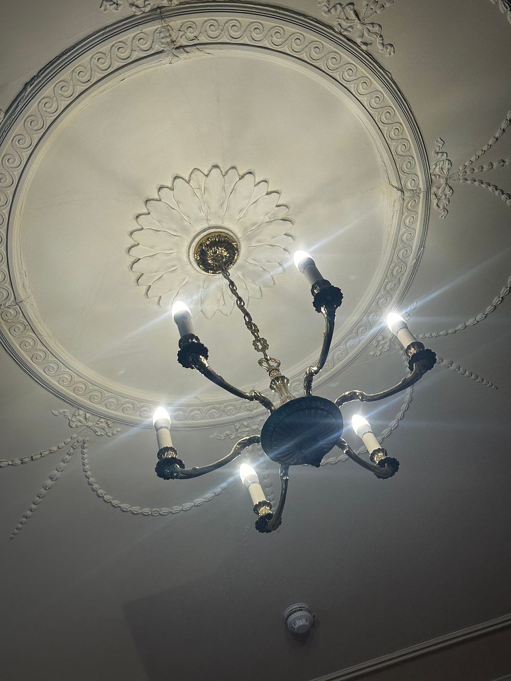 Lot 1097: A French Empire Style Patinated Metal Six-Arm Chandelier