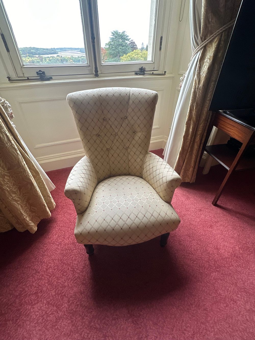 Lot 1117: A Traditional Upholstered High-Backed Armchair