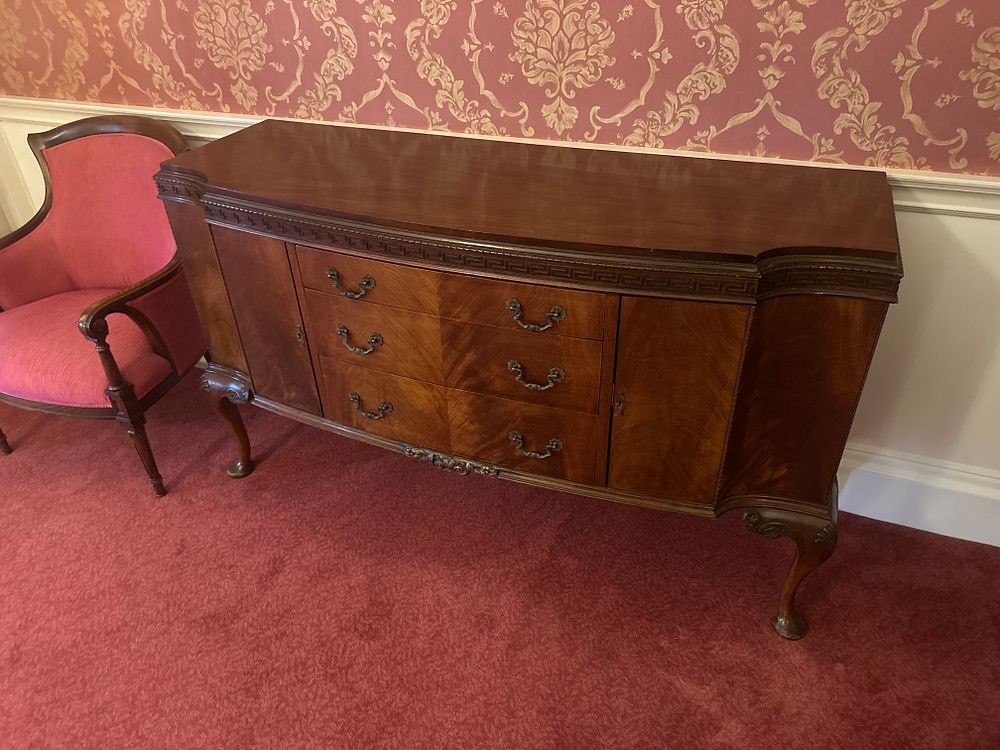 Lot 1136: A Victorian Chippendale Style Mahogany Serpentine-Front Sideboard